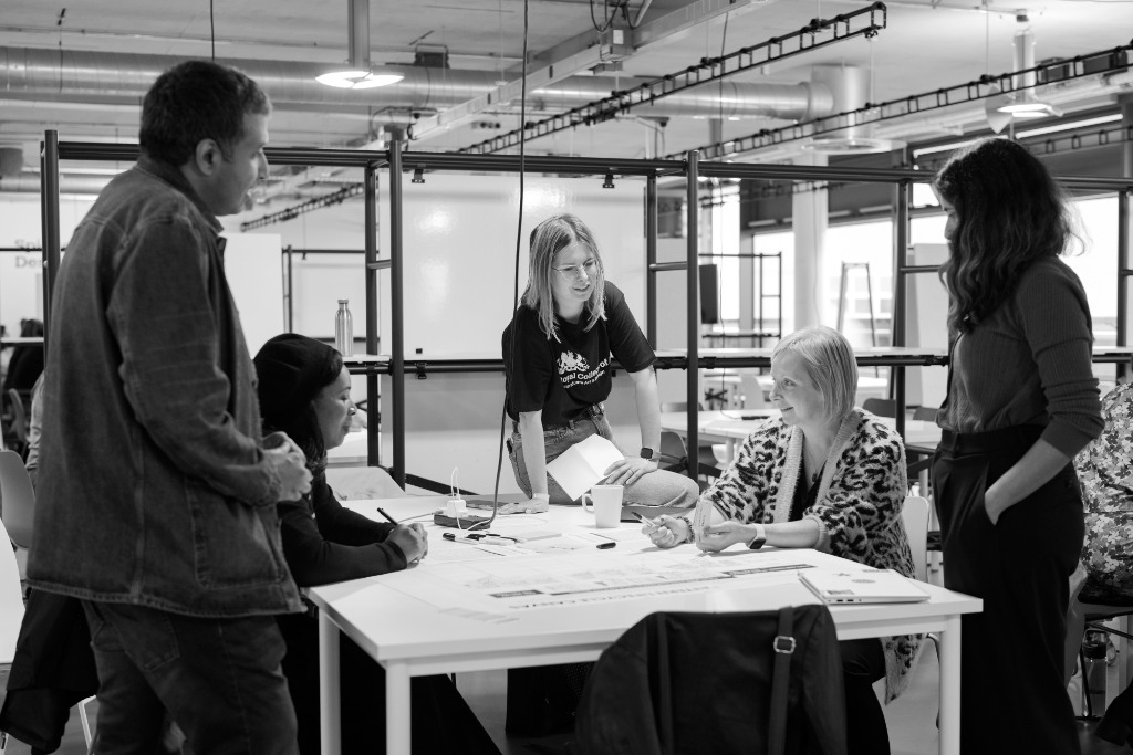 Civil servants collaborating around a table